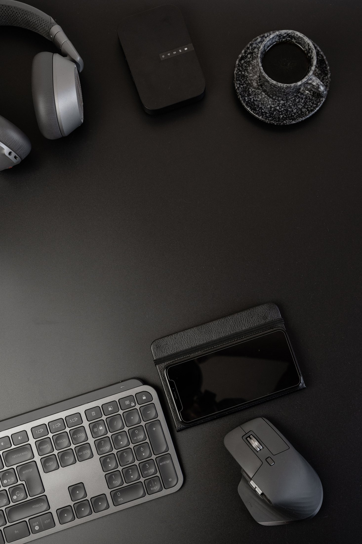 Office Gadgets and Accessories on Black Marble Table